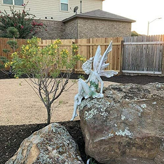 BowLift | Statue of sitting fairy in the garden