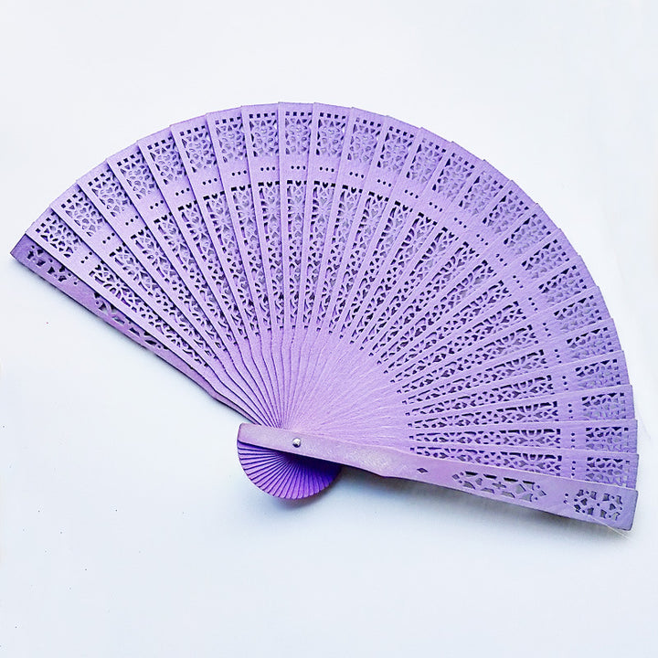 Women's fan made of elegant, intricately perforated material Bowlift