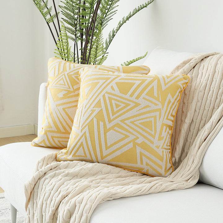 Square cushion cover with double-sided jacquard triangle motif and piping