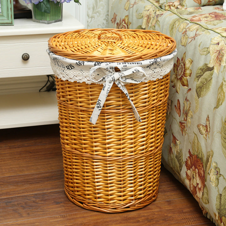 Women's laundry basket made of woven natural material with decorative fabric lining Bowlift