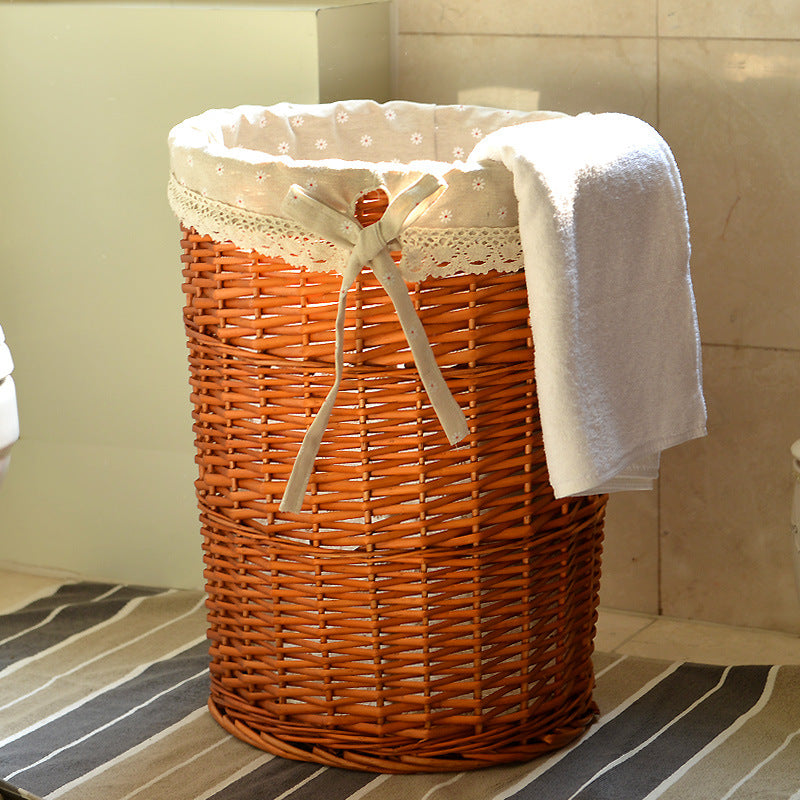 Women's laundry basket made of woven natural material with decorative fabric lining Bowlift