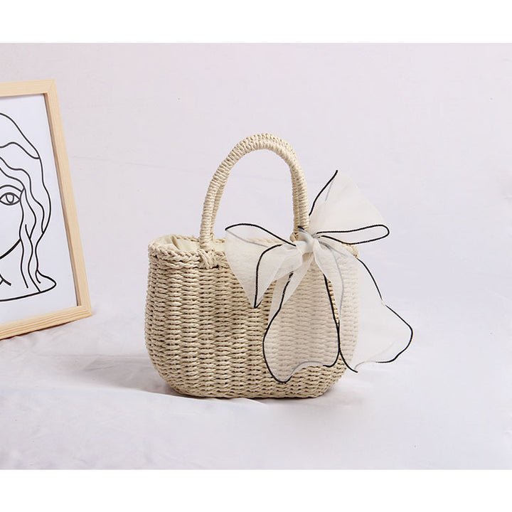 Handcrafted rattan bag with refined details Bowlift