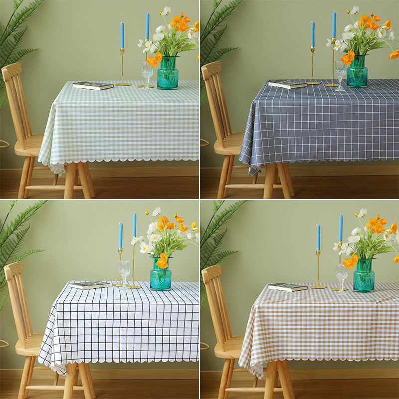 Round washable tablecloth with fine checkered grid pattern and wavy hem