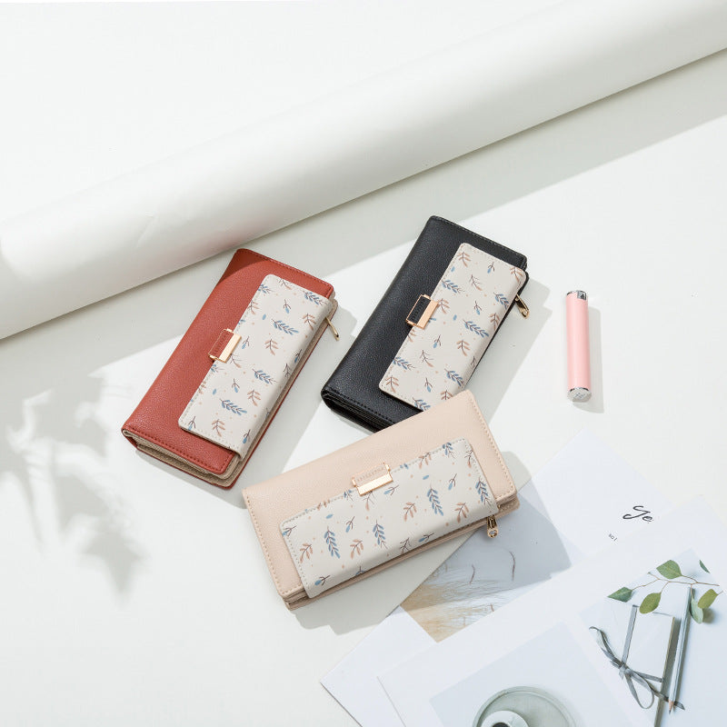 Continental floral print faux leather long wallet with organized card and coin compartments Bowlift