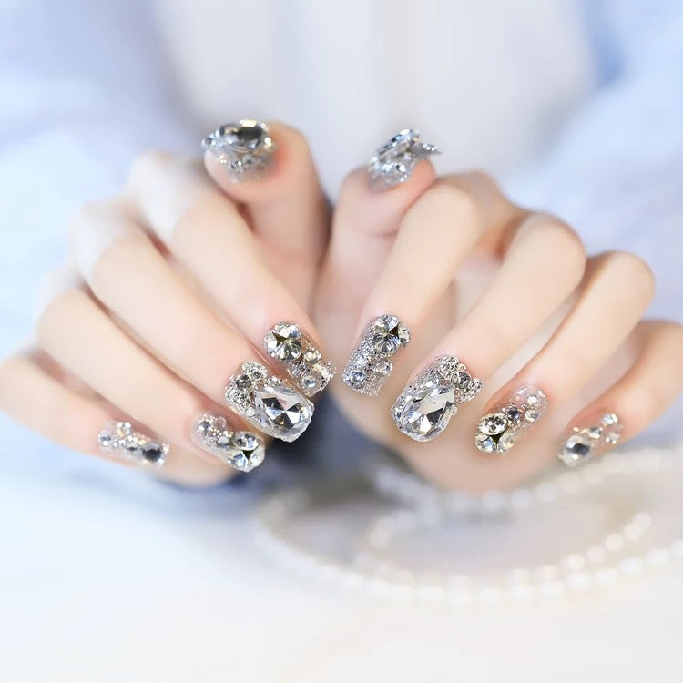 Nail art with glamorous rhinestone and glitter design Bowlift