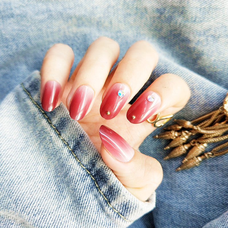 Artificial nails with elegant ombre effect and rhinestone decorations Bowlift