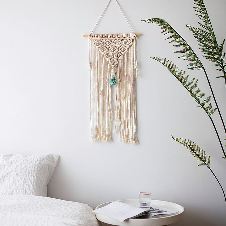 Macramé wall hanging with geometric triple tassel design and wooden rod Bowlift