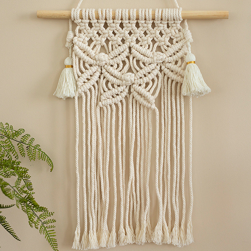 Macramé wall hanging with geometric triple tassel design and wooden rod Bowlift