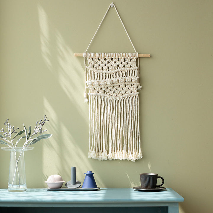 Macramé wall hanging with geometric triple tassel design and wooden rod Bowlift