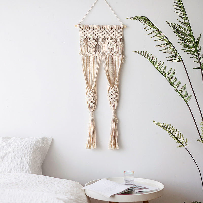 Macramé wall hanging with geometric triple tassel design and wooden rod Bowlift