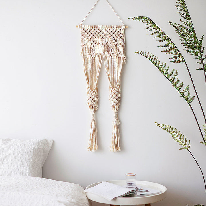Macramé wall hanging with geometric triple tassel design and wooden rod Bowlift