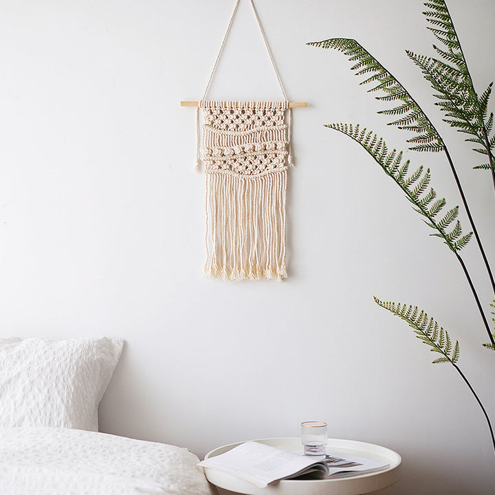 Macramé wall hanging with geometric triple tassel design and wooden rod Bowlift