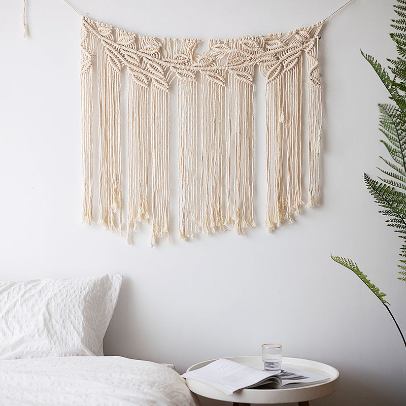 Macramé wall hanging with geometric triple tassel design and wooden rod Bowlift