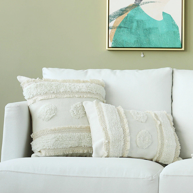 Decorative cushion cover with hand-tufted texture and fringe application