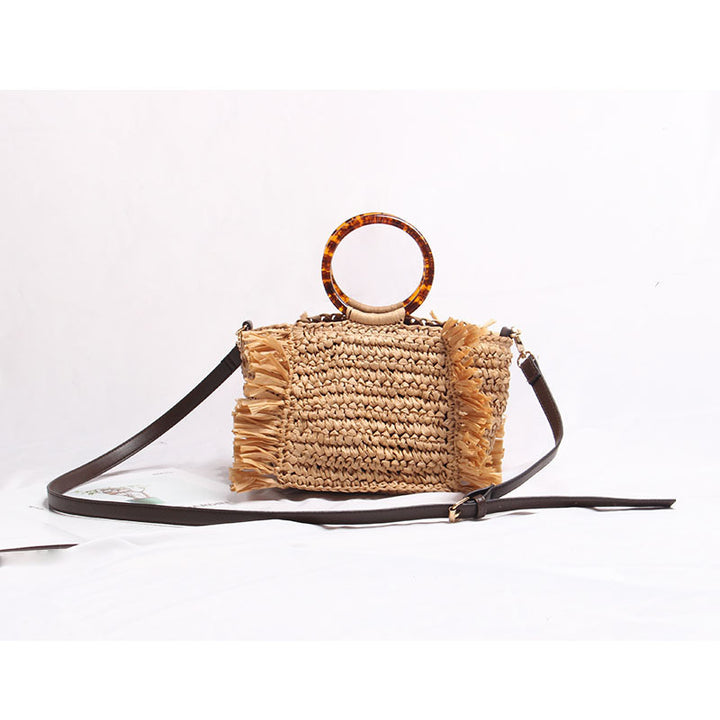 Handmade raffia shoulder bag with fringed accents Bowlift