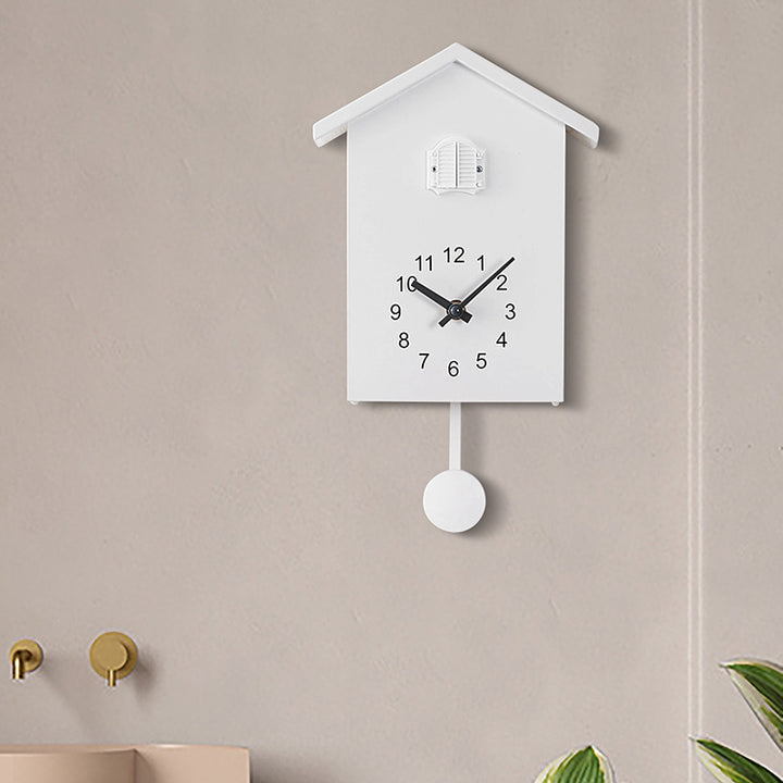 Cuckoo clock in creative house design Bowlift