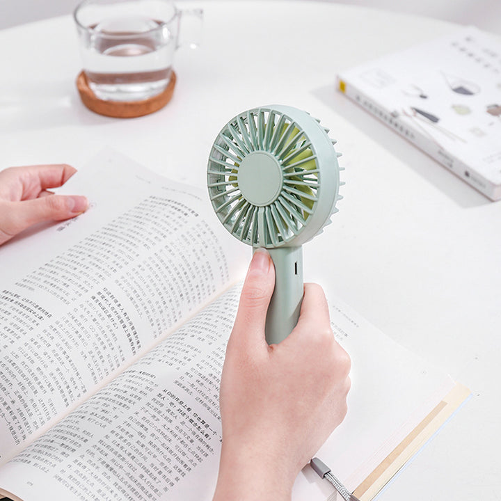 Unisex portable battery-operated mini hand fan with one-button operation and protected fan grill Bowlift
