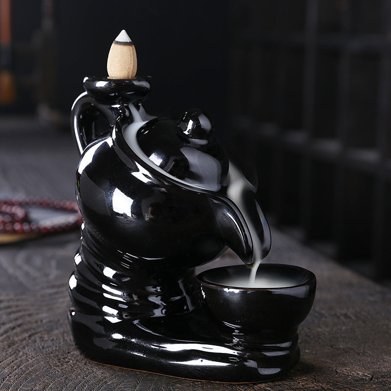 Elegant ceramic teapot-shaped incense burner