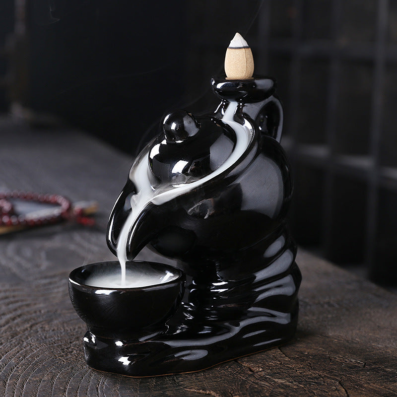 Elegant ceramic teapot-shaped incense burner