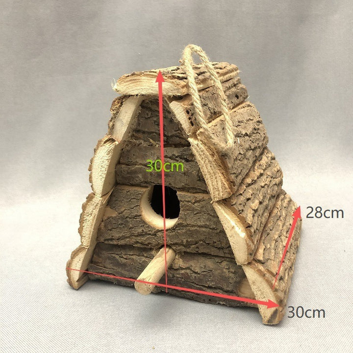 Rustic birdhouse made of wood with bark