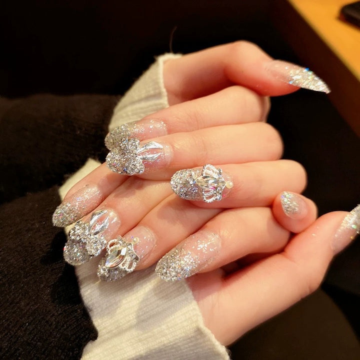 Nail art with sparkling rhinestone and glitter accents Bowlift