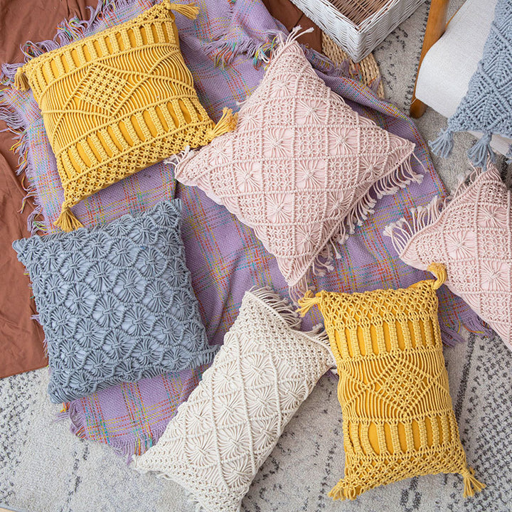 Rectangular cushion cover in macramé style with tufted floral appliqués and fringes
