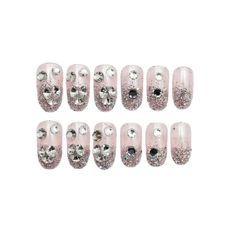 Sparkling artificial nails with rhinestones and sparkling accents Bowlift
