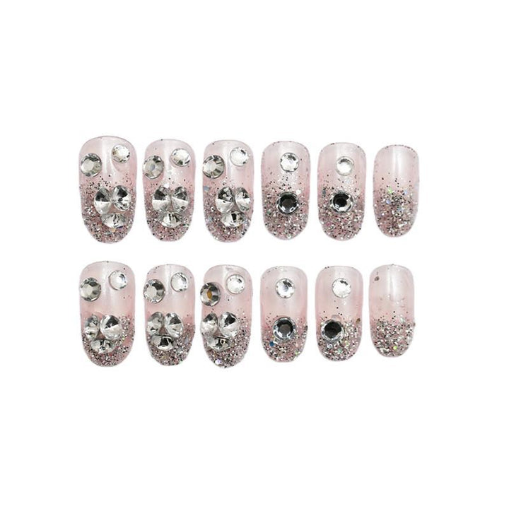 Sparkling artificial nails with rhinestones and sparkling accents Bowlift