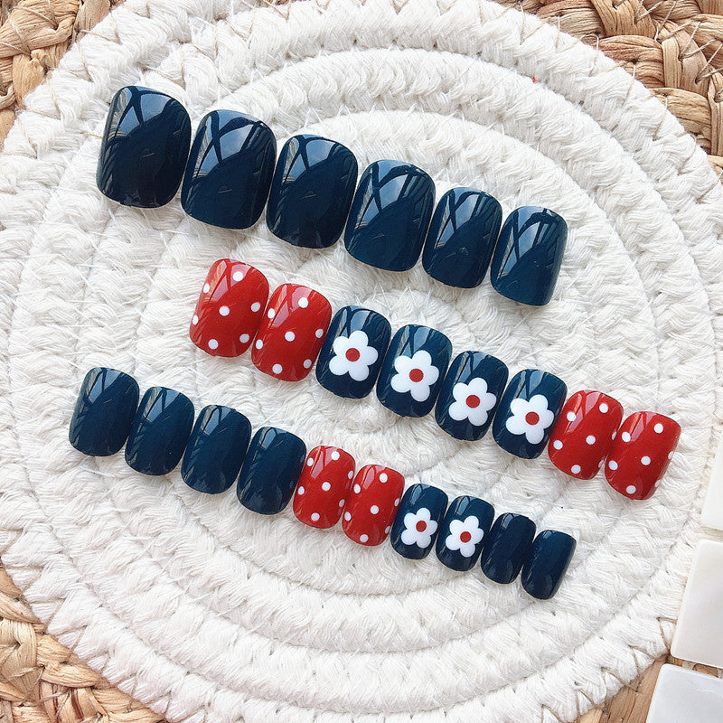 Artificial nails in a creative design with floral accents Bowlift