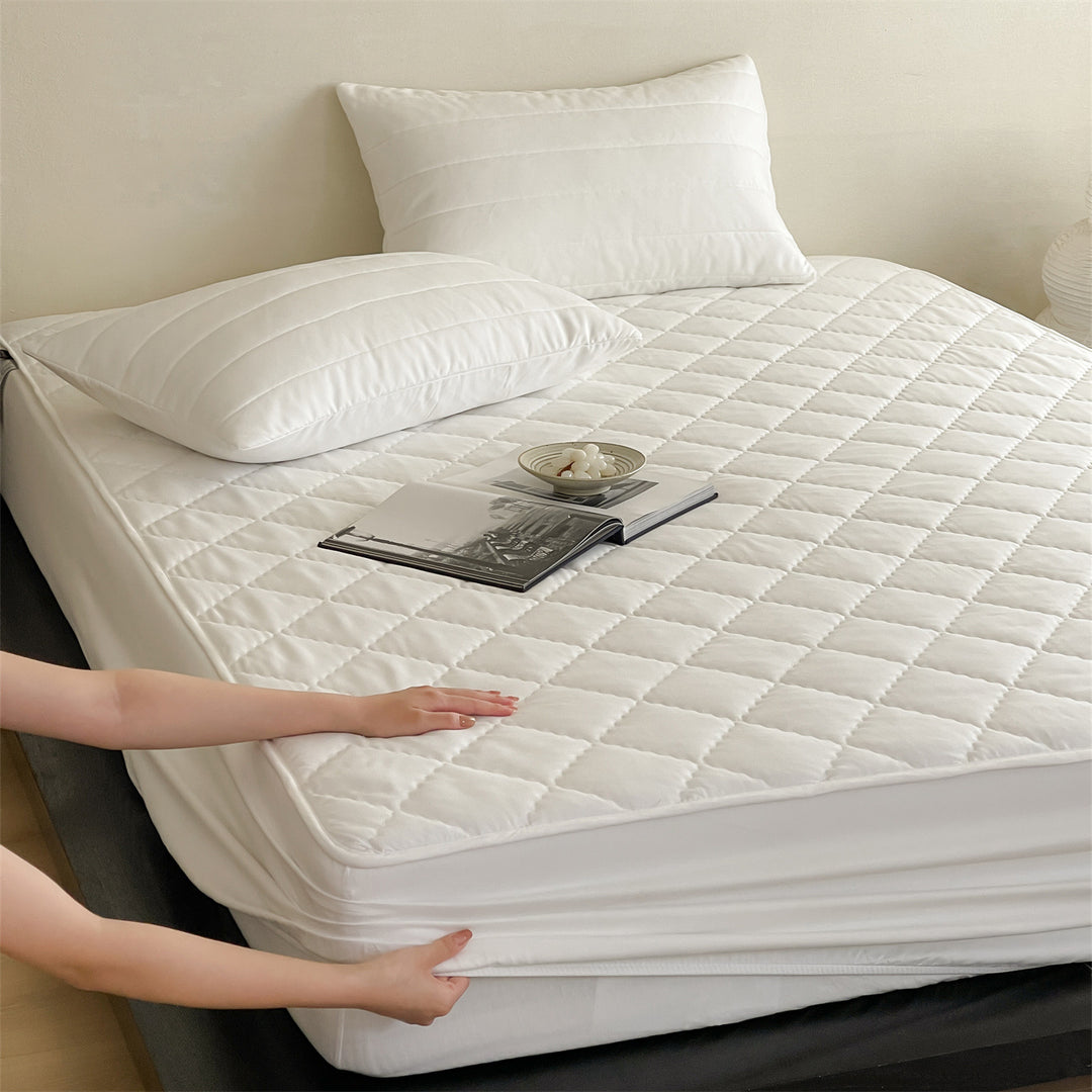 Waterproof, quilted mattress protector