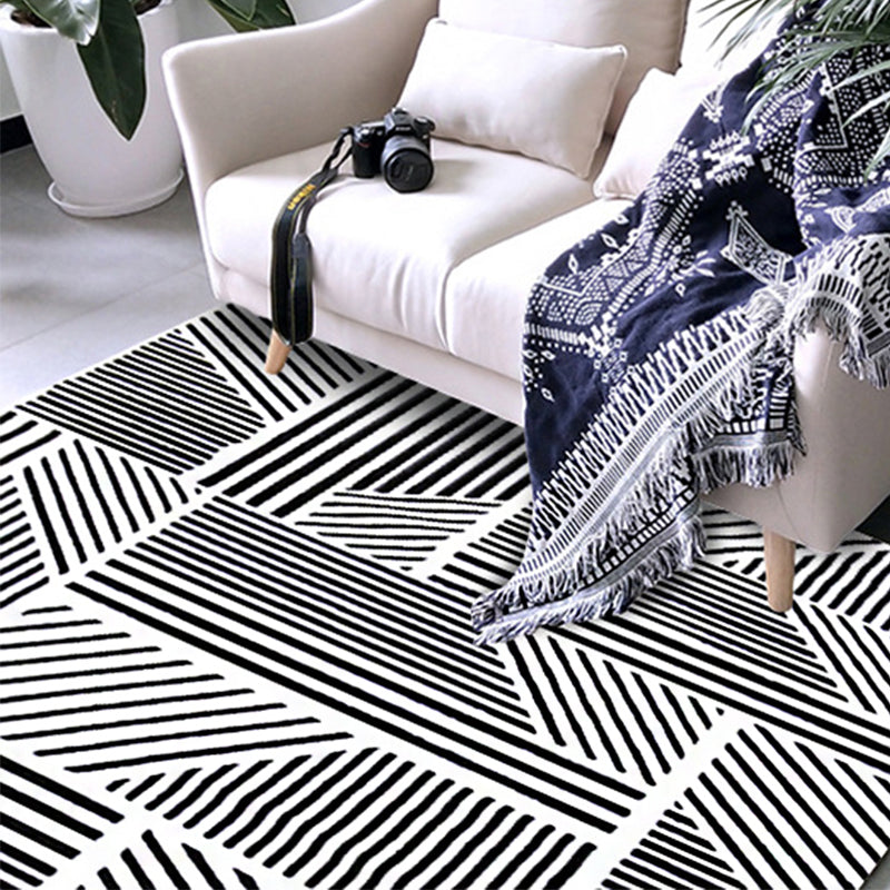 Modern living room rug in black and white with geometric stripe pattern rug polyester machine washable area rug | Bowlift