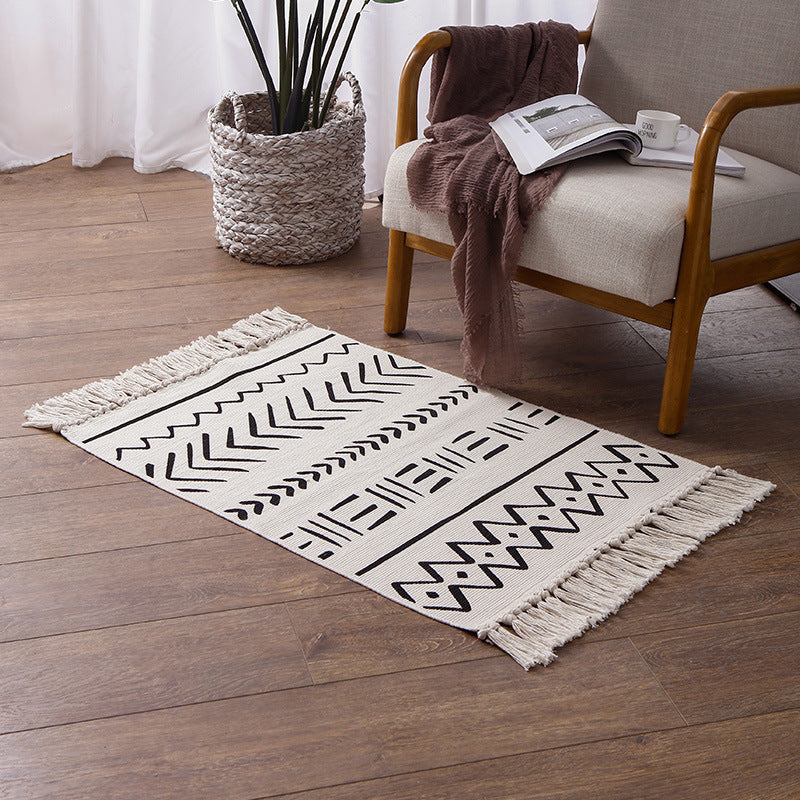Flat-woven rug runner in Boho Mudcloth design with cotton fringes