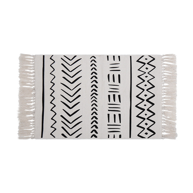 Flat-woven rug runner in Boho Mudcloth design with cotton fringes