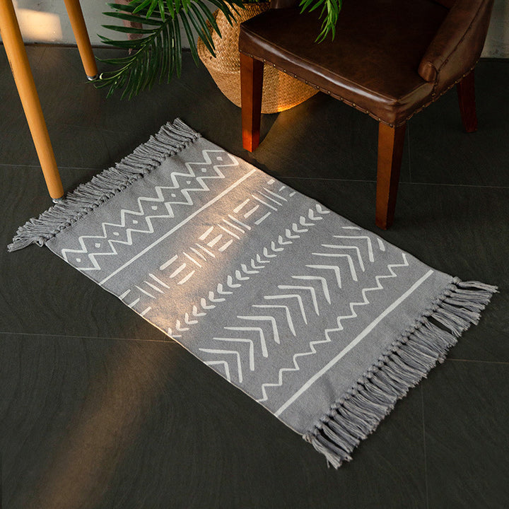 Flat-woven rug runner in Boho Mudcloth design with cotton fringes