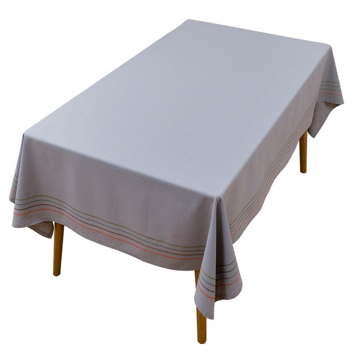 Rectangular tablecloth made of cotton-linen blend with fine embroidered stripe look and decorative tassels