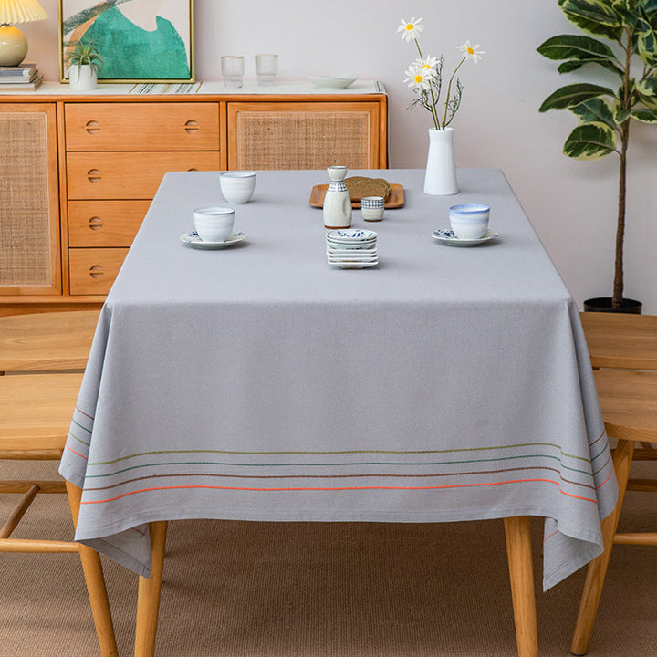 Rectangular tablecloth made of cotton-linen blend with fine embroidered stripe look and decorative tassels