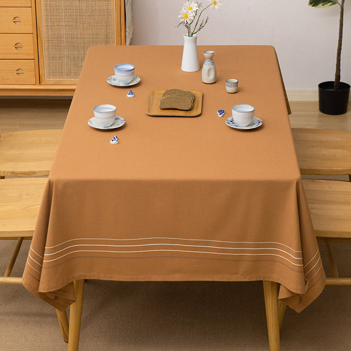 Rectangular tablecloth made of cotton-linen blend with fine embroidered stripe look and decorative tassels
