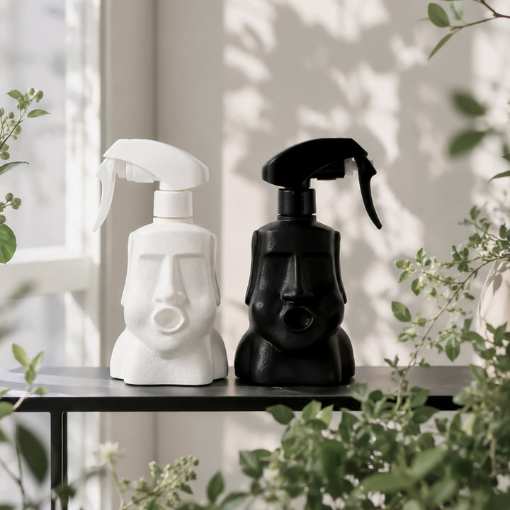 Moai-Garden plant sprayer with flower head