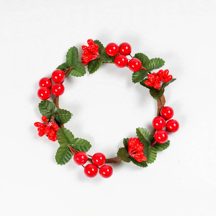 Christmas candle wreath with red berries