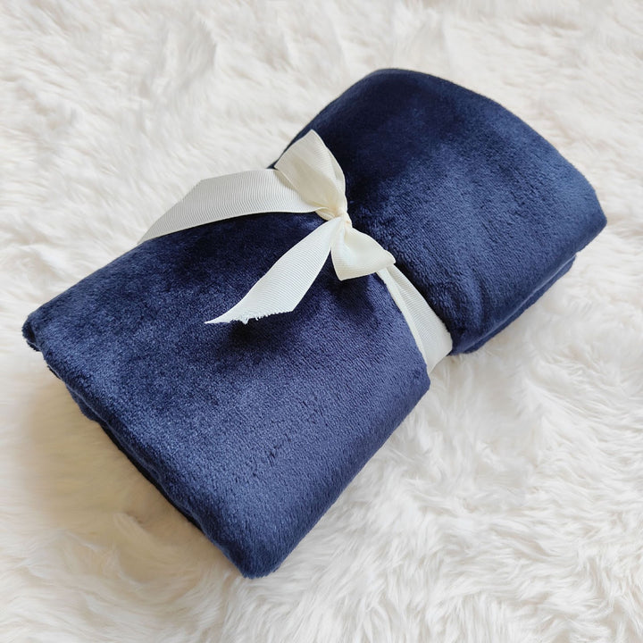 Coral fleece blanket in milk fiber look