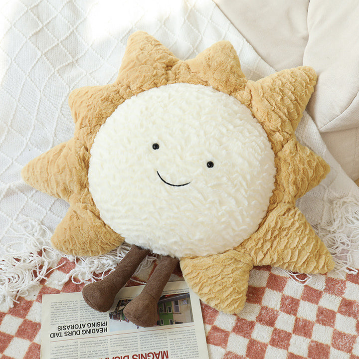Decorative cuddle cushions with moon, star, and sun motif