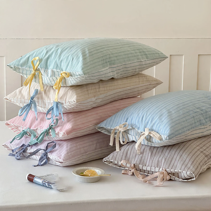 Cotton cushion cover with bow pattern