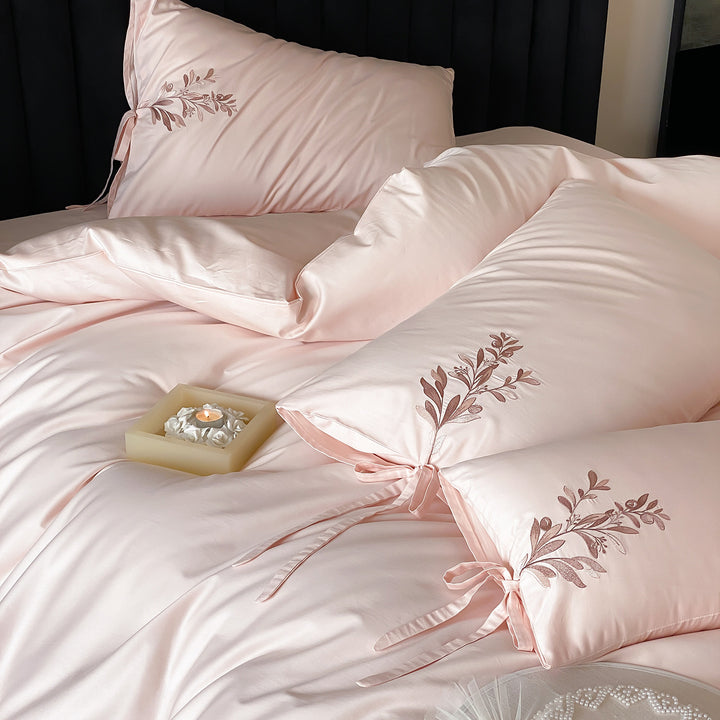 Embroidered cotton bedding with floral design