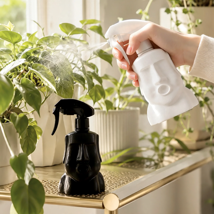 Moai-Garden plant sprayer with flower head