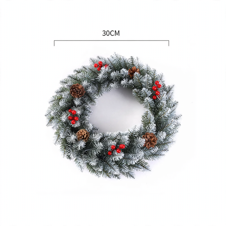 Christmas wreath with berries and pine cones