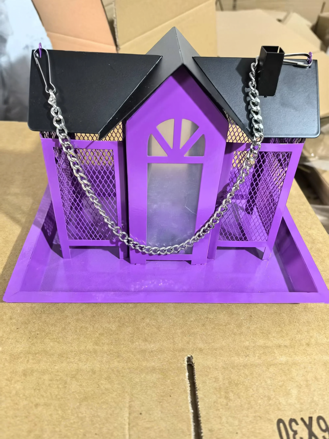 Hanging bird feeder in house shape with chain
