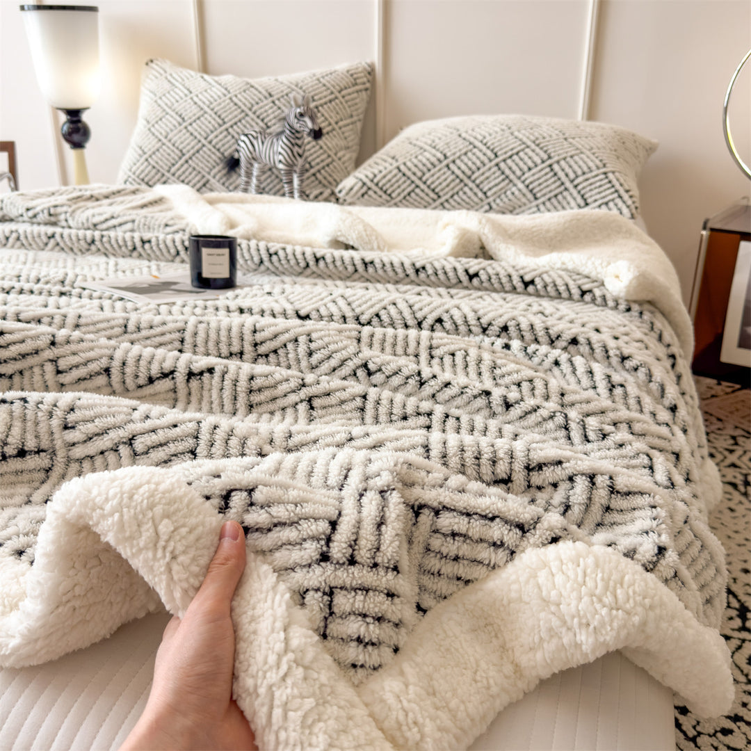 Patterned cuddle blanket with lamb fleece look