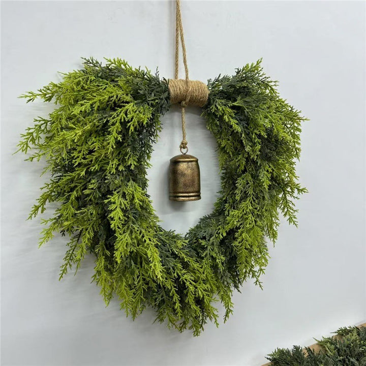 Heart-shaped Christmas wreath with bells