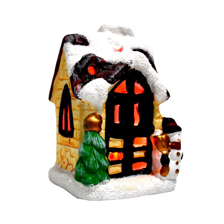 Illuminated Christmas house made of resin with snow effect