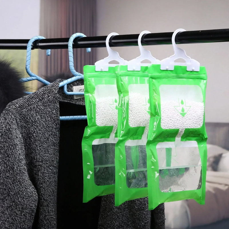 Hanging dehumidifying bags for wardrobes